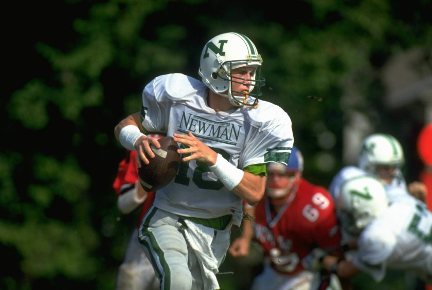 Peyton Manning runs with the ball during his high school days.