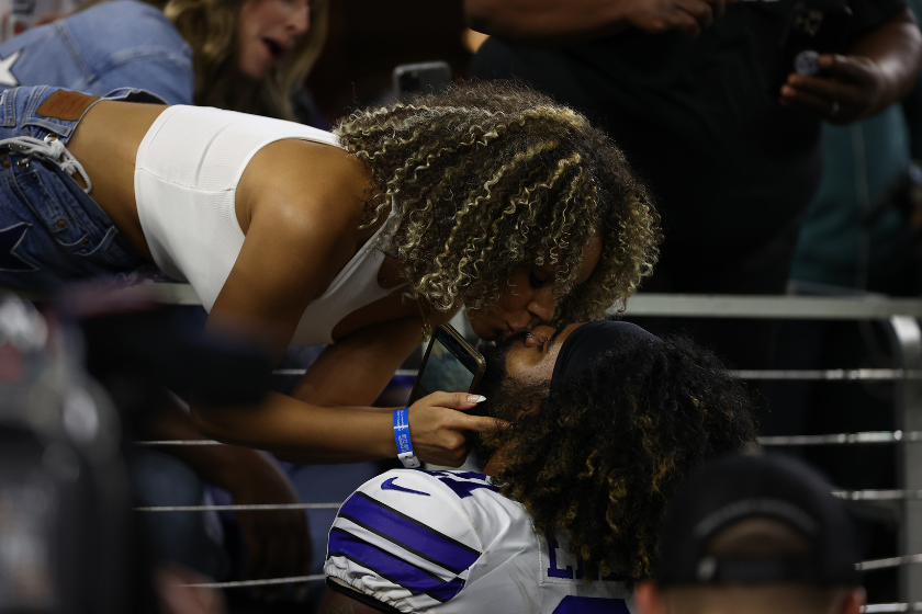 Ezekiel Elliott #21 of the Dallas Cowboys kisses girlfriend Halle Woodard after a 41-21 win over the Philadelphia Eagles
