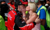 Kevin Harvick kisses DeLana Harvick in Victory Lane after winning at Auto Club Speedway in 2015