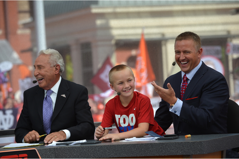 Kirk herbstreit and his son, along with Lee Corso, smile on ESPN's College Gameday in 2015.