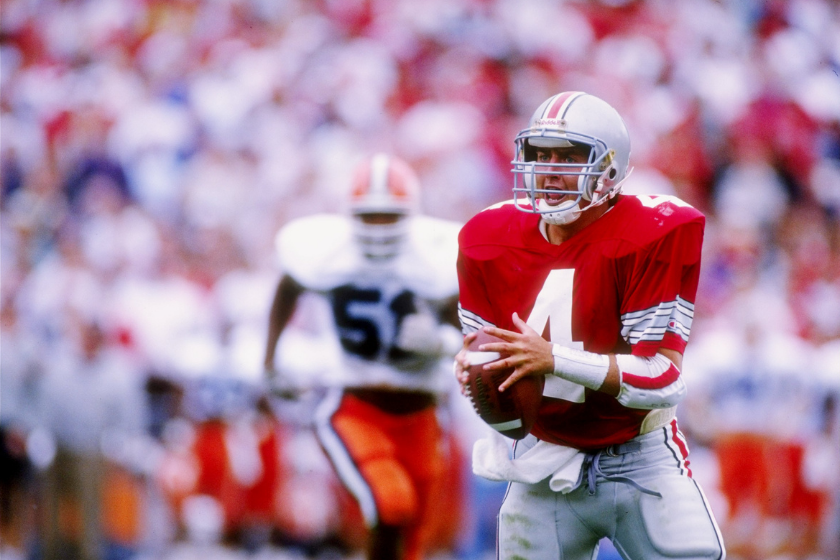Ohio State quarterback Kirk Herbstreit rolls out to pass against Illinois in 1992.