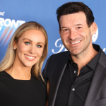 Candice Romo, wife of Dallas Cowboys quarterback Tony Romo, hands out  headbands she had bought for the girls registered during Romo' annual  football fundamentals camp at Burlington High School, Wednesday June 22