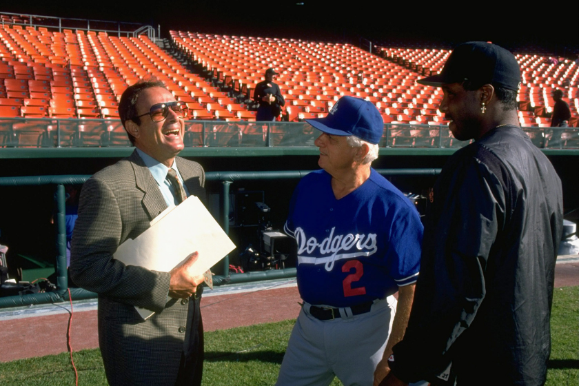 Al Michaels talks with Tommy Lasorda and Barry Bonds.