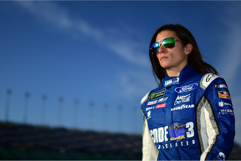 Danica Patrick walks to her car on the grid during qualifying for the Monster Energy NASCAR Cup Series Hollywood Casino 400 at Kansas Speedway on October 20, 2017