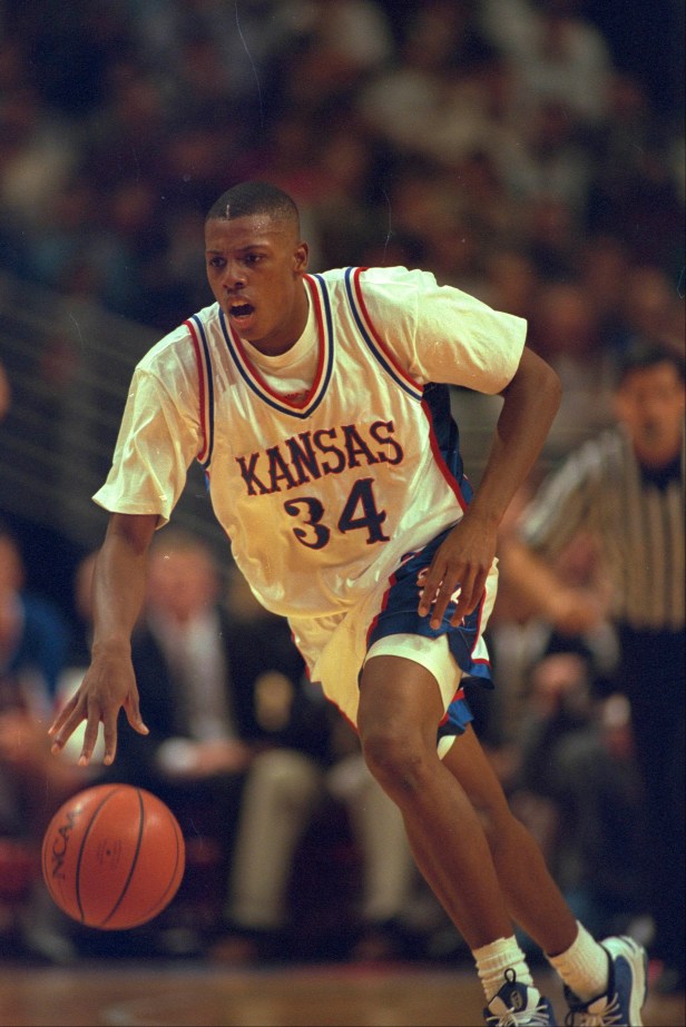 Kansas forward Paul Pierce dribbles upcourt against Cincinnati.