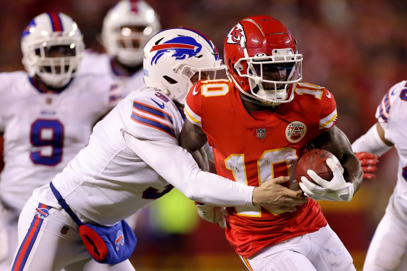 Tyreek Hill runs with the ball during the Bills-Chiefs NFL playoff game in 2022.