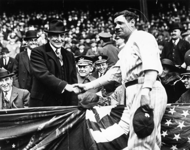 Babe Ruth shakes hands with presient Warren Harding.