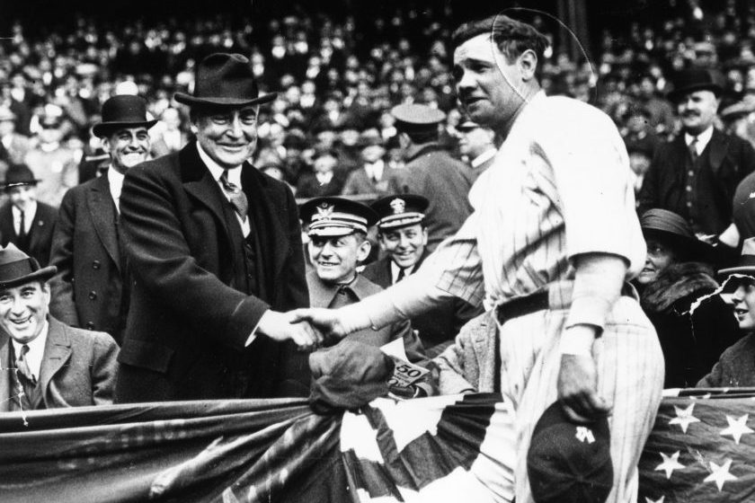 Babe Ruth shakes hands with presient Warren Harding.