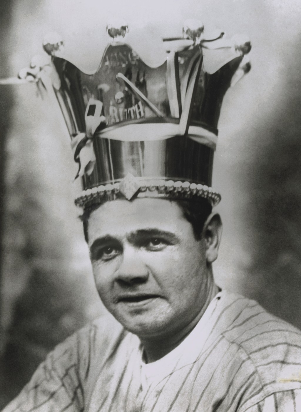 Babe Ruth wears a crown for a photo.