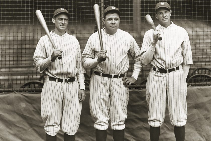 Babe Ruth stands with Yankees teammates.