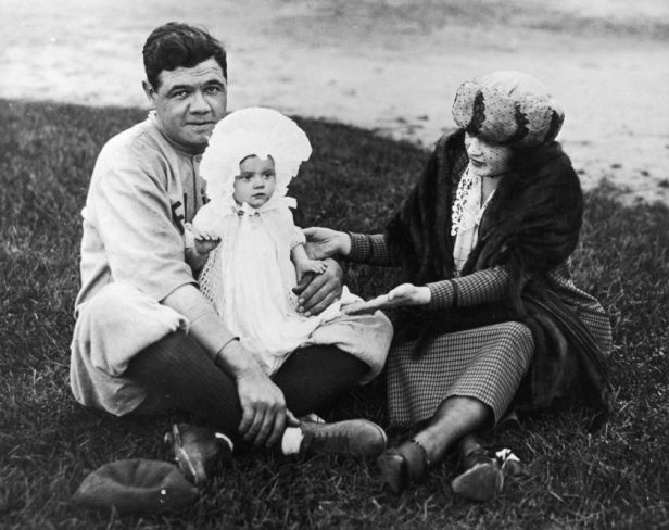 Babe Ruth poses with wife and daughter.