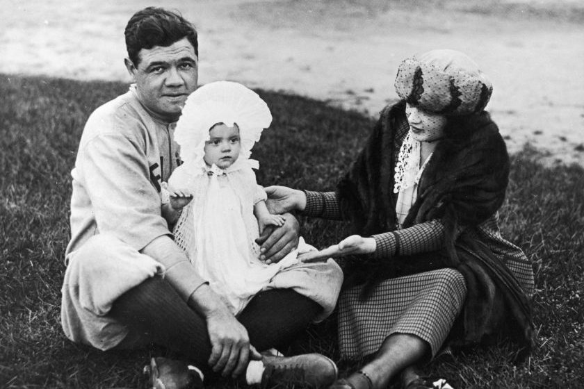 Babe Ruth poses with wife and daughter.