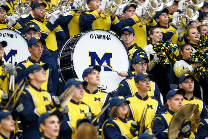 Members of the Michigan Wolverines marching band perform during the Advocare Classic college football game between the Michigan Wolverines and Florida Gators