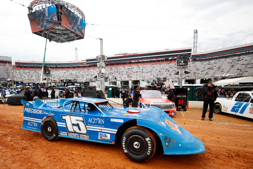 Dirt Late Model cars drive through the pit road area during qualifying for the NASCAR Camping World Truck Series Pinty's Truck Race on Dirt at Bristol Motor Speedway on March 27, 2021 in Bristol, Tennessee