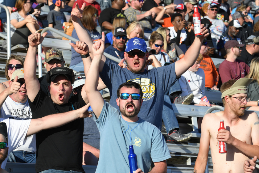 Race fans react to action on the track during the running of the Folds of Honor QuikTrip 500 on March 20, 2022 at Atlanta Motor Speedway in Hampton, Ga