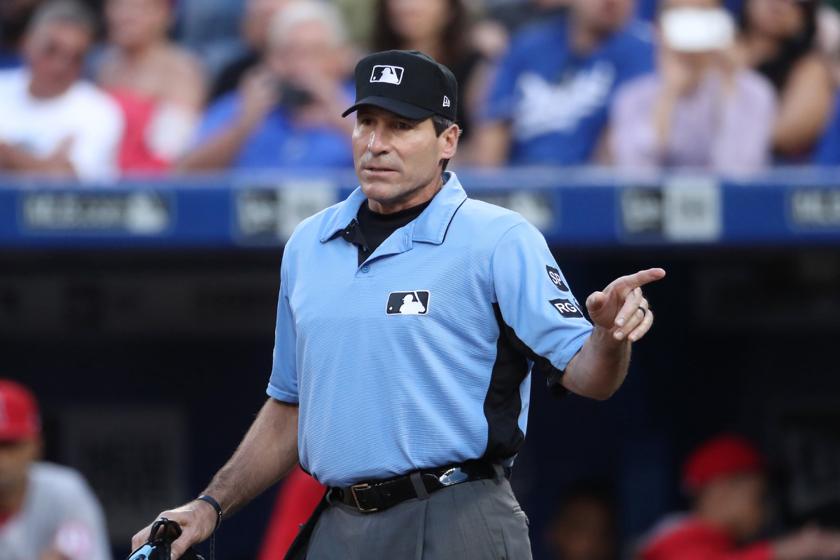 Angel Hernandez warns an MLB manger to not argue a call.