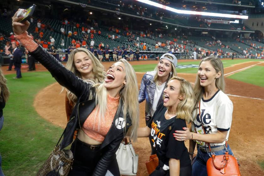 Daniella Rodriguez, Kat Rogers, Kate Upton and Amy Cole take a selfie on the field afterhe Houston Astros won Game 5 of the ALDS against the Tampa Bay Rays
