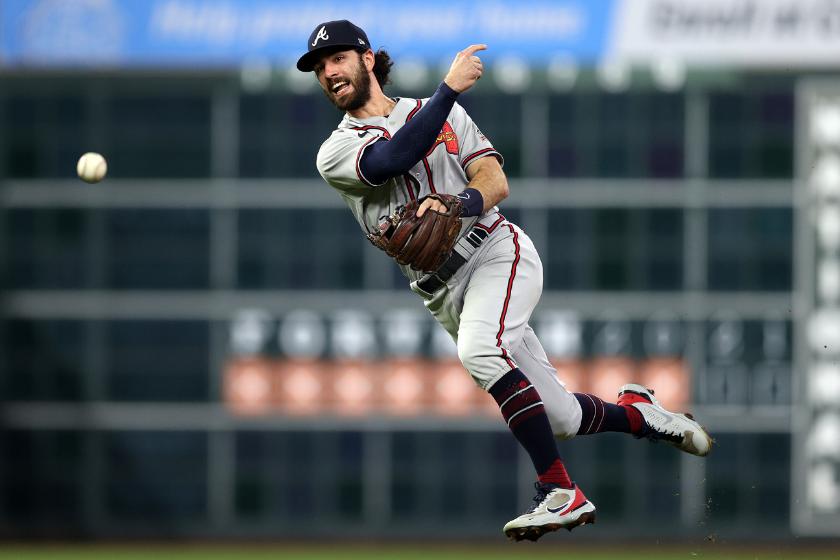 Dansby Swanson #7 of the Atlanta Braves throws out the runner against the Houston Astros during the second inning in Game Six of the World Series