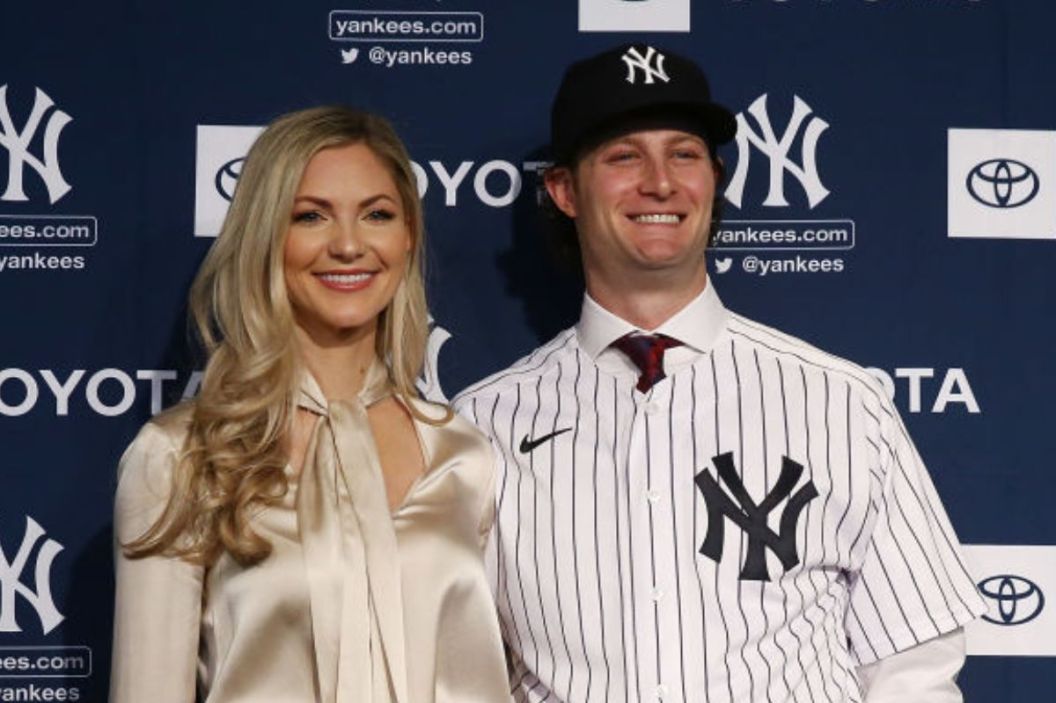 errit Cole and his wife Amy Cole pose for a photo at Yankee Stadium during a press conference at Yankee Stadium