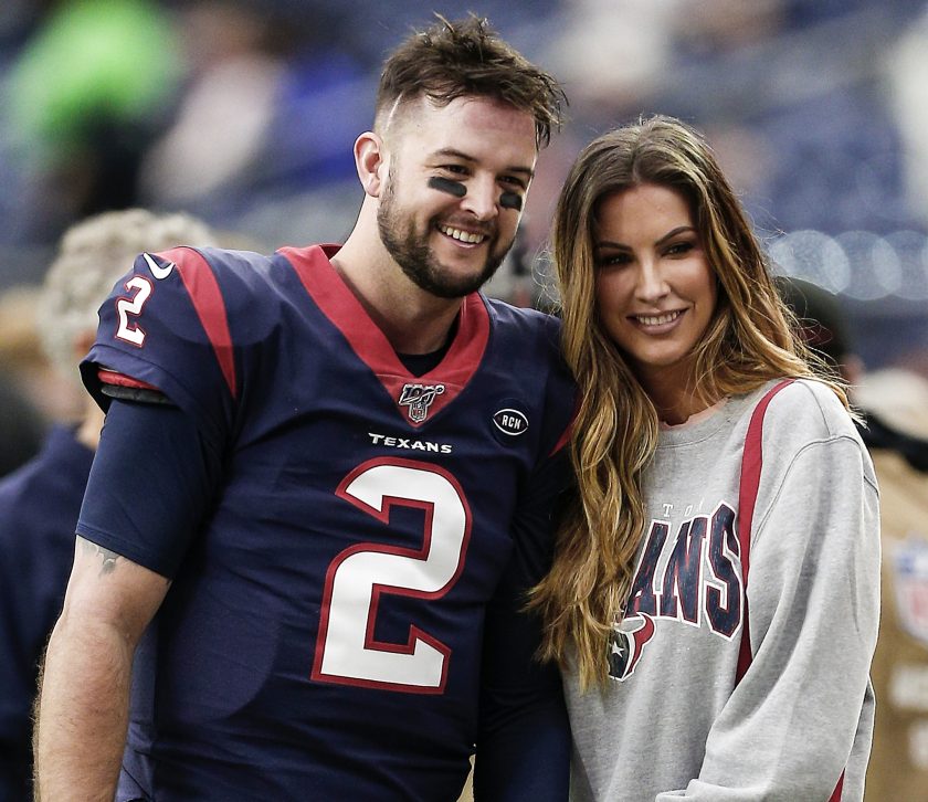 Katherine Webb and AJ McCarron before an NFL game in 2019.