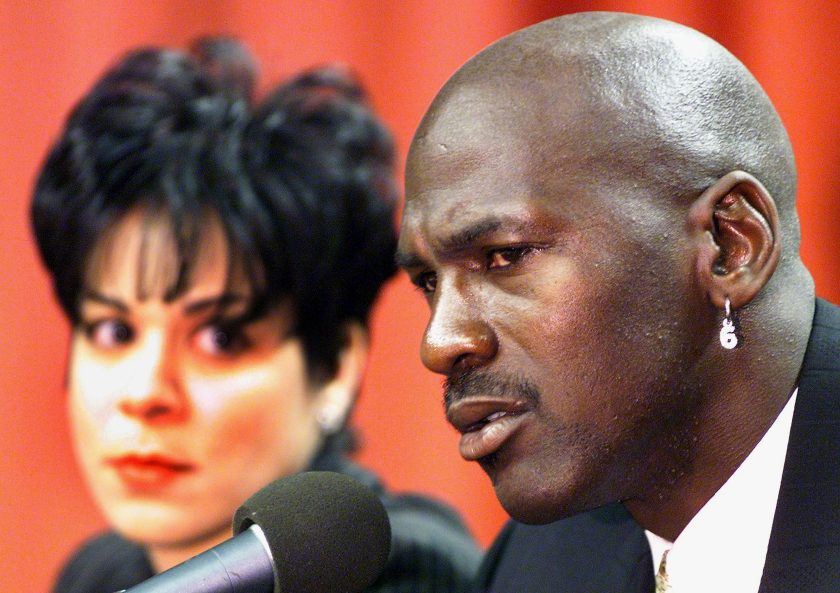 Michael Jordan announces his retirement with Juanita by his side.