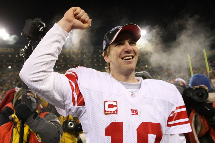 Eli Manning celebrates after beating the Packers. 