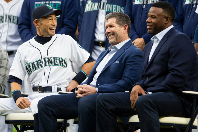 Ichiro Suzuki laughs with former Seattle Mariners players Edgar Martinez and Ken Griffey Jr. as Suzuki receives the Seattle Mariners Franchise Achievement Award