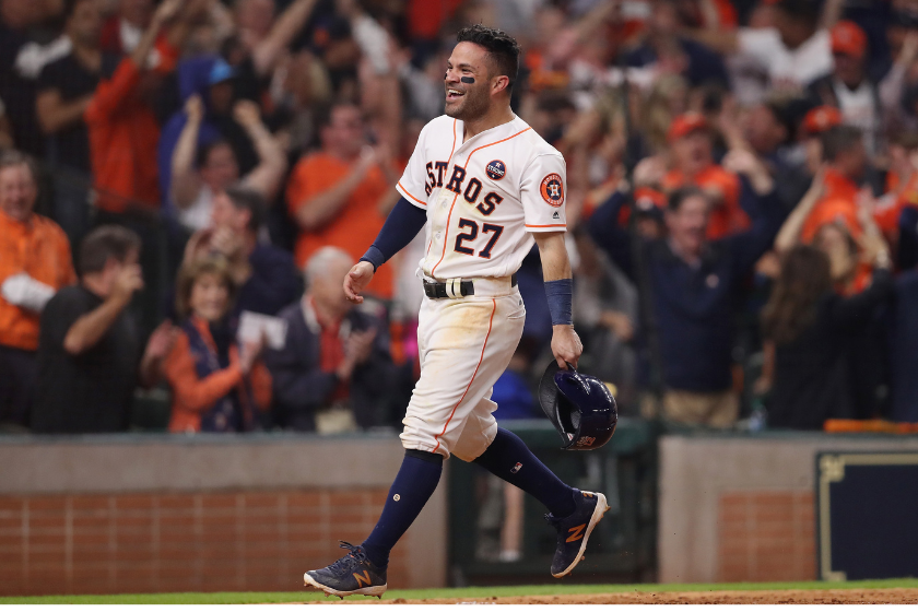 Jose Altuve #27 of the Houston Astros celebrates after scoring on a home run by Carlos Correa #1 during the seventh inning against the Los Angeles Dodgers in game five of the 2017 World Series
