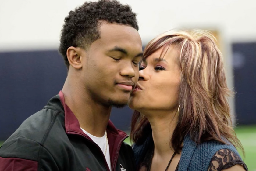 Kyler Murray gets a kiss from his mother, Missy. 