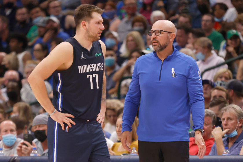 Luka Doncic #77 of the Dallas Mavericks talks with head coach Jason Kidd as the team takes on the Houston Rockets in the second half at American Airlines Center