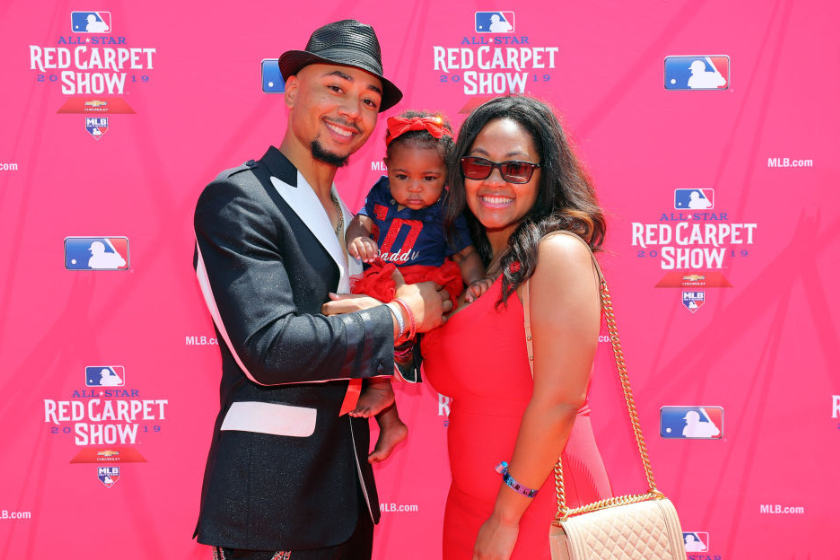 Mookie Betts poses with his wife and daughter during the MLB Red Carpet Show presented by Chevrolet at Progressive Field 