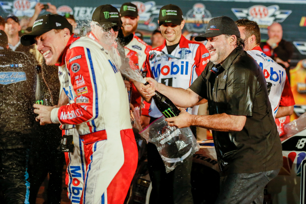 Tony Stewart sprays champagne on Kevin Harvick after winning the 2018 AAA Texas 500 at Texas Motor Speedway