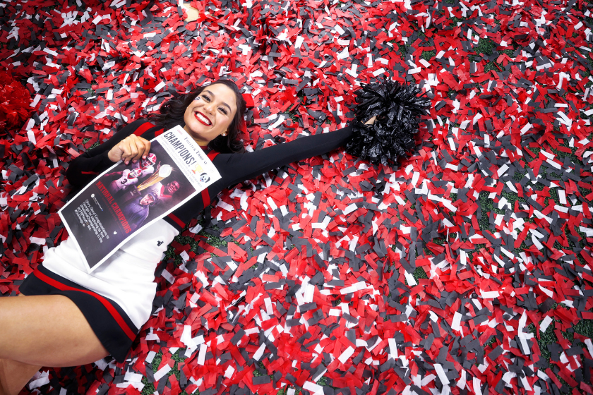 A Georgia Cheerleader lays in confetti after the Bulldogs National Championship Title Victory.
