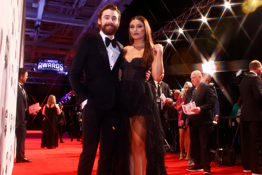 Ryan Blaney and guest Gianna Tulio pose on the red carpet prior to the NASCAR Champion's Banquet at the Music City Center on December 02, 2021 in Nashville, Tennessee