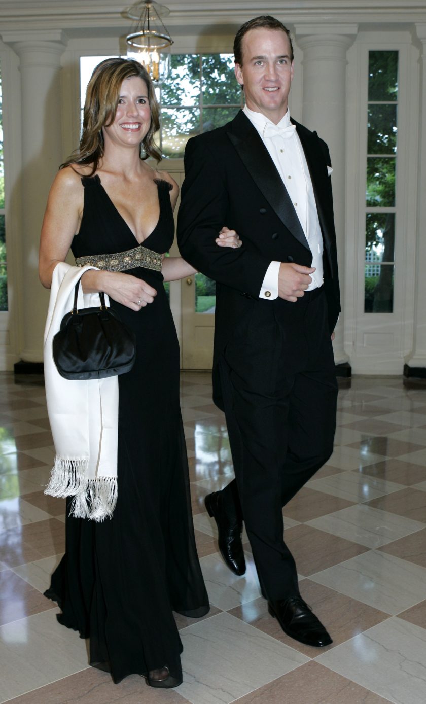 Peyton Manning and wife Ashley walk through the White House.