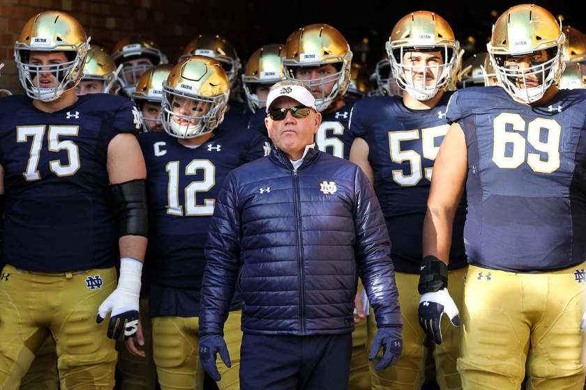 ead coach Brian Kelly of the Notre Dame Fighting Irish looks on before the game against the Navy Midshipmen