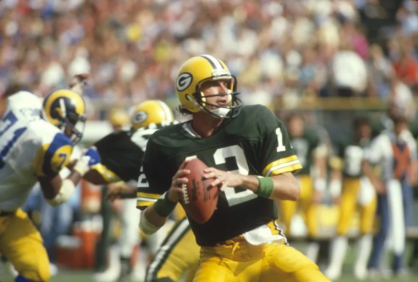 Lynn Dickey of the Green Bay Packers drops back to pass against the Los Angeles Rams during an NFL football game September 12, 1982