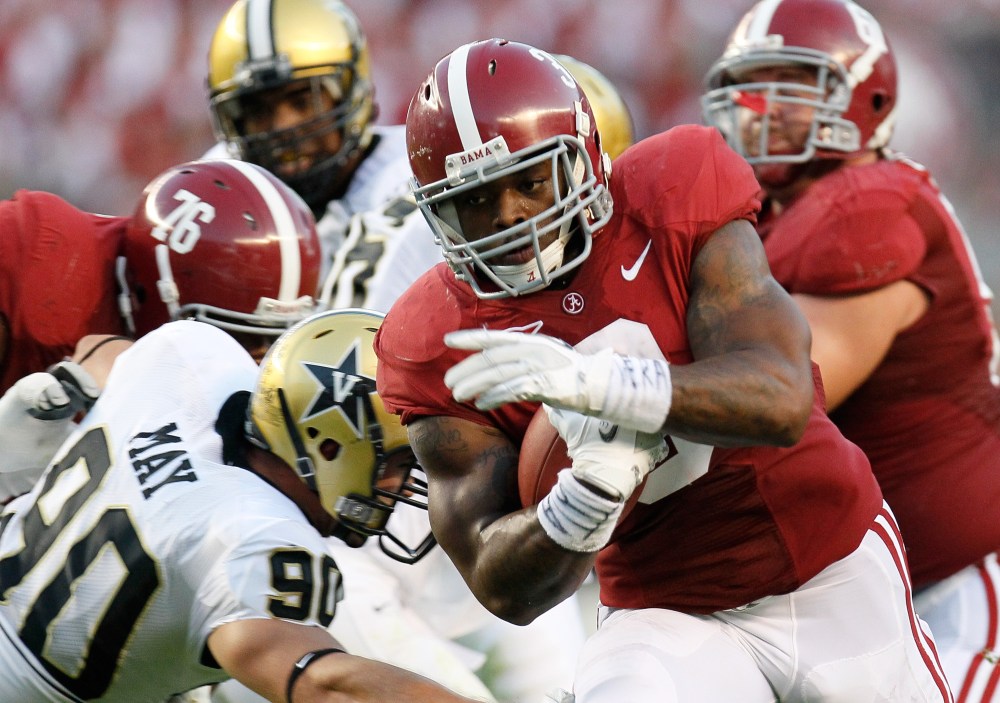 Trent Richardson carries the ball for Alabama.