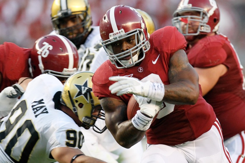 Trent Richardson carries the ball for Alabama.