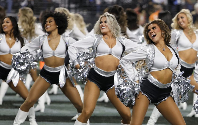 Las Vegas Raiderettes cheer during a game against the Los Angeles Chargers in 2022.