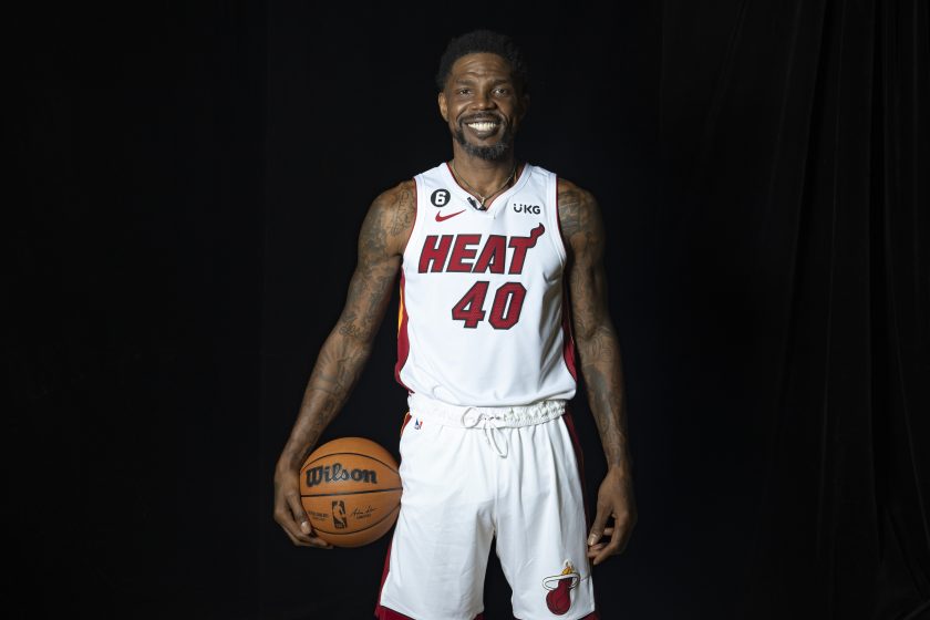 Udonis Haslem poses for a photo holding a basketball.