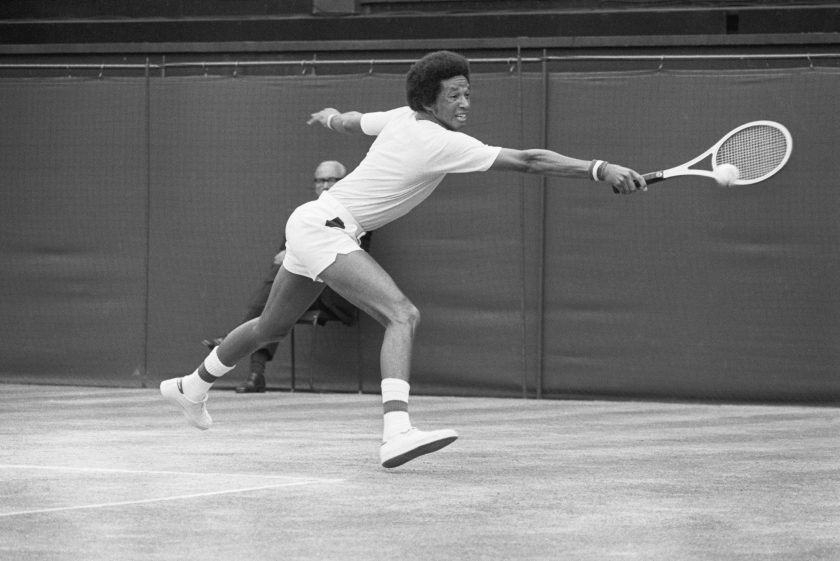arthur Ashe reaches for a shot in 1975.