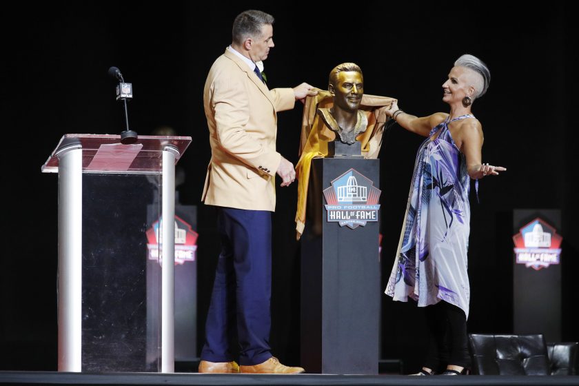Kurt Warner and wife Brenda Warner unveil his bust during the Pro Football Hall of Fame Enshrinement Ceremony.