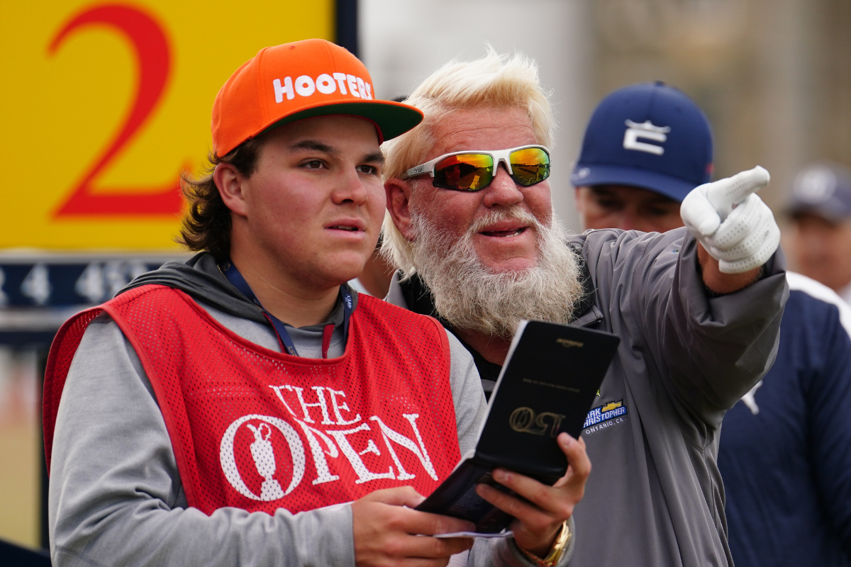 USA's John Daly on the 2nd tee with his son and caddies John Daly II during day one of The Open at the Old Course, St Andrews.
