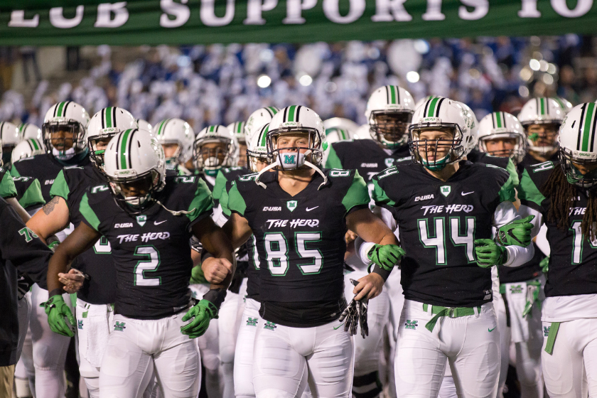 The Herd enters the stadium before a Marshall football game. 