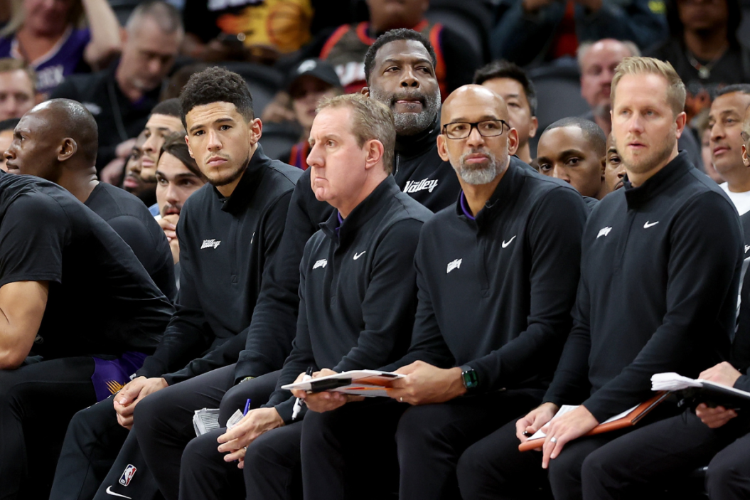 Phoenix Suns head coach Monty Williams looks on with his coaching staff during a NBA playoff game.
