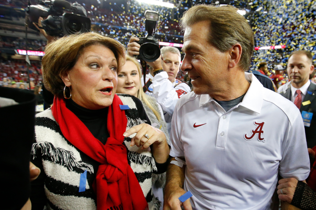 Head coach Nick Saban of the Alabama Crimson Tide celebrates with his wife Terry Saban after defeating the Florida Gators 29-15 in the SEC Championship game at the Georgia Dome.