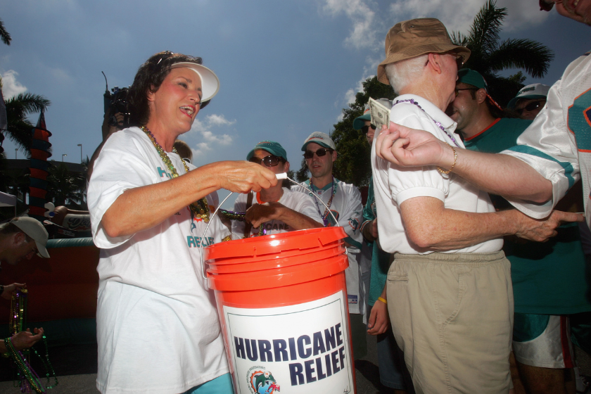 erry Saban, wife of Miami Dolphins head coach Nick Saban, collects donations for the victims of Hurricane Katrina before the game against the Denver Broncos.