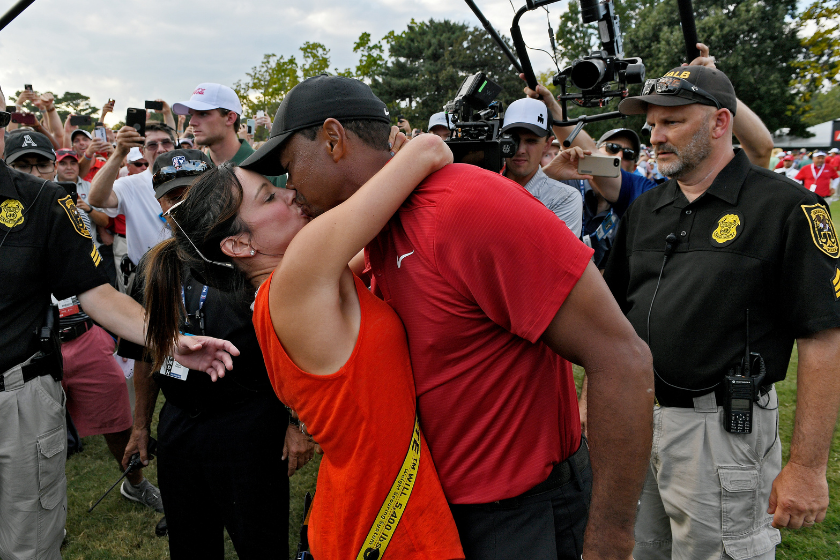 Tiger Woods kisses his girlfriend Erica after winning the 2018 TOUR championship.