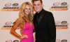 Ty Dillon and his wife Haley Carey pose on the red carpet during the 2015 NASCAR Camping World Truck Series and XFINITY Series Banquet